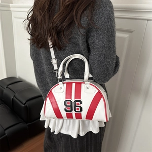 Retro sport Boston bag with red stripes and number 96 patch in a stylish crossbody view