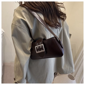 Detailed back view of a dark coffee shoulder bag with a vintage silver metallic buckle