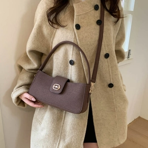 Retro brown textured fabric crossbody bag with gold buckle and adjustable strap