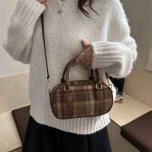 Brown plaid wool handheld bowling bag with leather handles and crossbody strap