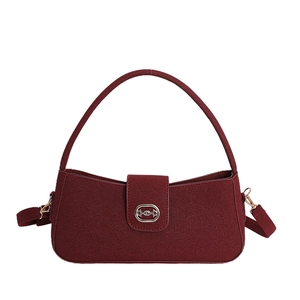 Deep red suede hobo bag with vintage matte finish and oval gold metal buckle