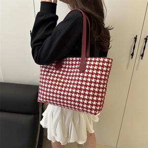 Chic red and white houndstooth tote bag with leather straps for autumn fashion style