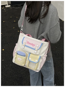 Detail of multi-pocket patchwork tote bag featuring macaron colors and adjustable strap