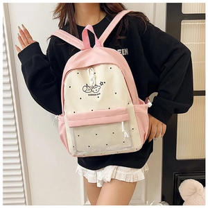 Pink and beige school backpack featuring cartoon bear print and transparent polka dot pocket