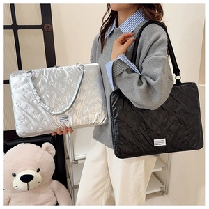 Quilted tote bags in silver and black with teddy bear pattern and dual handles