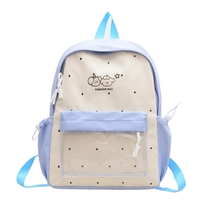 Pastel blue and beige polka dot student backpack featuring a cute cartoon puppy design