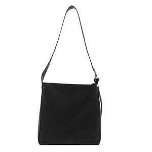 Minimalist black leather bucket bag with adjustable strap and gold metal hardware