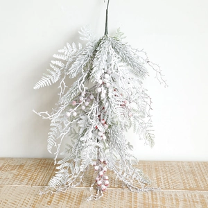 Detail of 60cm Christmas swag with flocked pine needles and red berries for winter decor