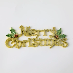 Golden Merry Christmas sign ornament with green holly leaves and red berries on white background
