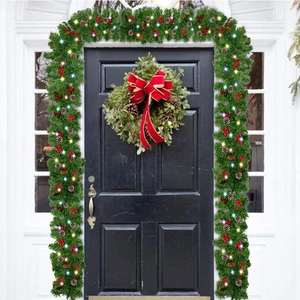 Green 2.7m pre-lit Christmas garland with pine cones and red berries for door decoration