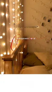 Close-up of warm white Christmas LED bulb strings and copper fairy lights decoration