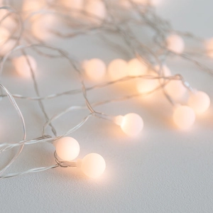 Frosted warm white LED decorative ball string lights for festive holiday atmosphere lighting