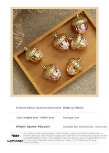 Set of 5 champagne gold acorn Christmas ornaments with snowflake patterns on wood tray