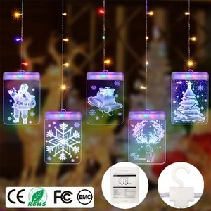 Détail de suspensions LED de Noël en acrylique 3D avec motifs flocon et renne
