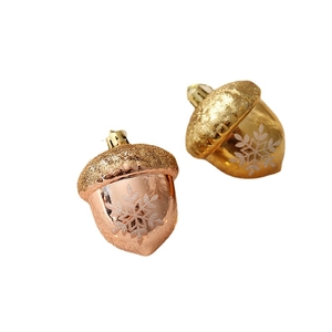 Golden and rose gold acorn Christmas ornaments with glitter tops and white snowflakes