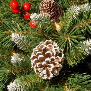 Artificial Christmas hanging basket with pine needles, snow-tipped cones and LED lights