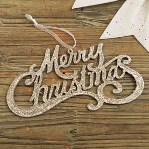 Détail d'ornement Merry Christmas en paillettes dorées sur fond de bois rustique