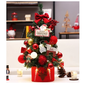Detailed view of a 45cm mini desktop Christmas tree with red bows and LED warm lights