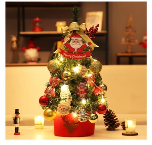 Mini tabletop Christmas tree with warm LED lights, red deer base and festive ornaments
