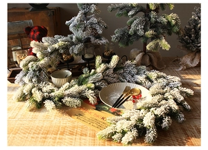 Detail view of 1.8m frosted Christmas garland with thick artificial snow on pine needles