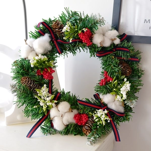 Christmas wreath with pine cones cotton balls and navy striped bows for door decor