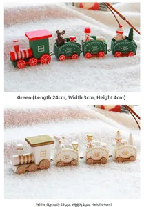 Detailed close-up of green and white wooden Christmas train decor on a white fur rug