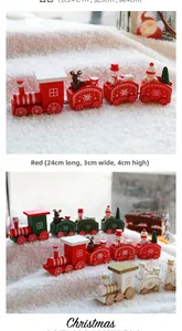 Detail of red wooden Christmas train with snowman and santa claus figures 24x3x4cm