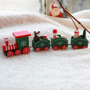 Wooden Christmas train set with Santa, snowman and bear models on white plush carpet