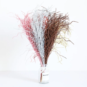 Sparkly glitter decorative branches in glass vase for Christmas home decor