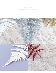 Detailed view of glittered fern leaves in gold, red, silver, and white for Christmas decor