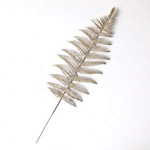 Glittery gold artificial fern leaf stem for Christmas tree decoration and festive floral arrangements