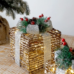 Three-piece gold lighted Christmas gift boxes with bows and warm LED lights decor