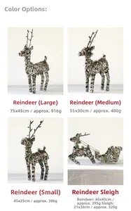Detailed view of woven rattan reindeer and sleigh decorations with festive pine accents