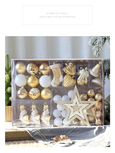 Christmas tree decoration set with gold and white baubles, stars and bells in gift box