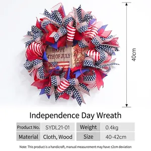 Patriotic Independence Day wreath with red white and blue ribbons and Happy 4th of July sign