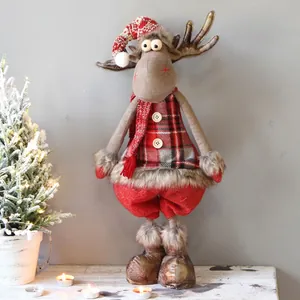 Detail of extendable plush Christmas elk doll standing between 70-85cm on wooden table
