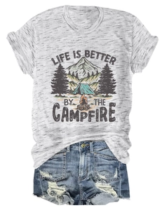 Flat lay of gray campfire graphic t-shirt with mountain print and ripped denim shorts