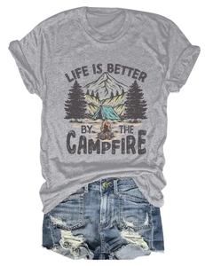 Detail view of campfire graphic t-shirt paired with distressed denim shorts