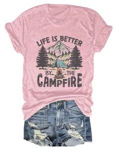 Close-up of pink campfire graphic t-shirt with ripped denim shorts summer outfit set