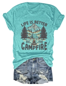 Flat lay of life is better by the campfire tee with distressed denim shorts