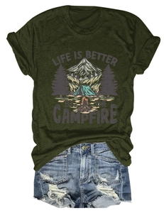 Detail of campfire print on olive green t-shirt paired with ripped denim shorts