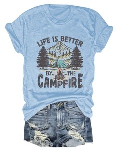 Detail of life is better by the campfire print on a light blue cotton short sleeve t-shirt