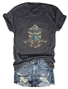 Detail of campfire print on grey t-shirt paired with distressed denim shorts