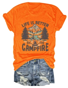 Detail of orange t-shirt with campfire print paired with distressed denim shorts