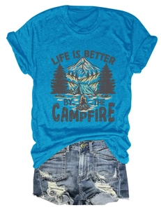 Detail of the camping graphic print and lettering on a blue crewneck T-shirt