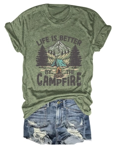 Detail of green Life is better by the campfire t-shirt paired with ripped denim shorts