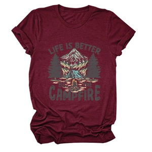 Detailed flat lay of maroon t-shirt featuring campfire and mountain graphic design