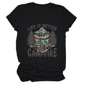 Detail of cotton t-shirt with campfire and mountain graphic print on black fabric