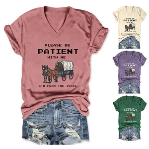 Detail showing vintage V-neck T-shirt color options with carriage print and slogan