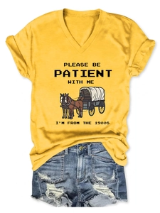 Detail of V-neck ginger cotton T-shirt featuring vintage horse carriage graphic and text
